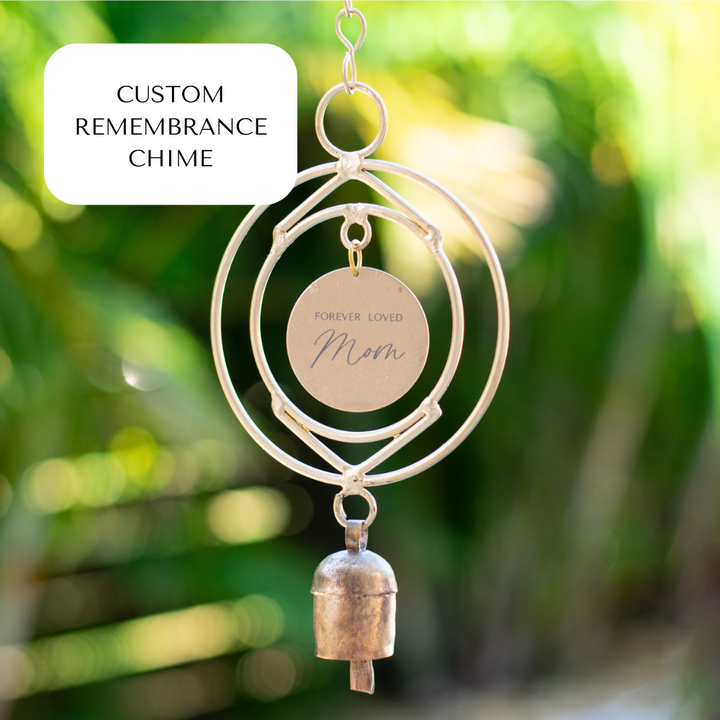 A close-up of a wind chime in the middle with "Forever Loved Mom" text in the middle and a text box with "custom remembrance chime" on the left.
