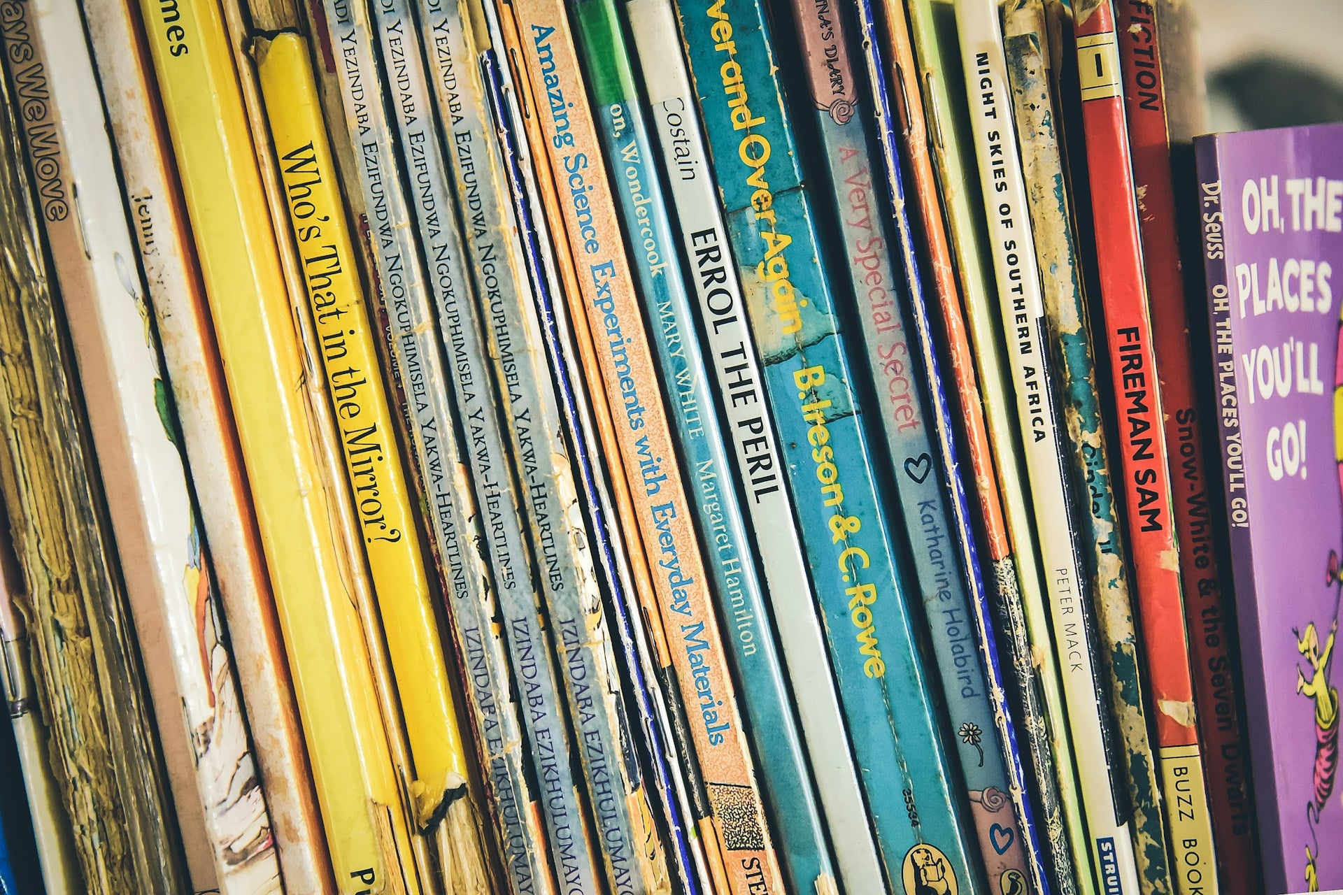 Stack of children's books with colorful spines