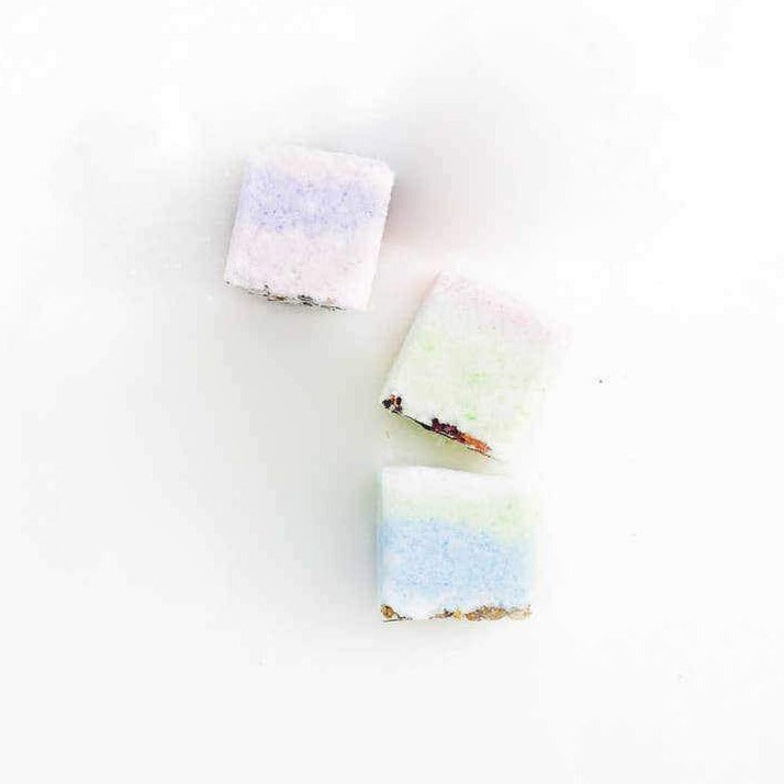 photo of three chalky squares in yellow, purple and green