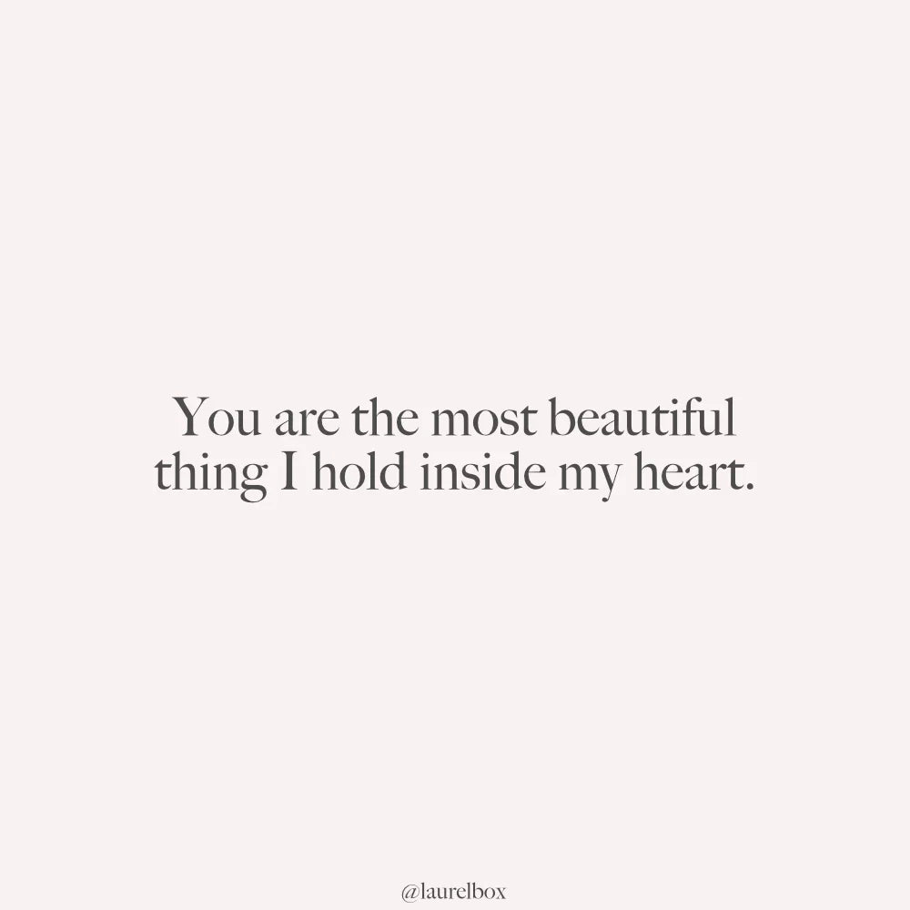 Minimalistic design with light pink background and gray text reading, "You are the most beautiful thing I hold inside my heart."