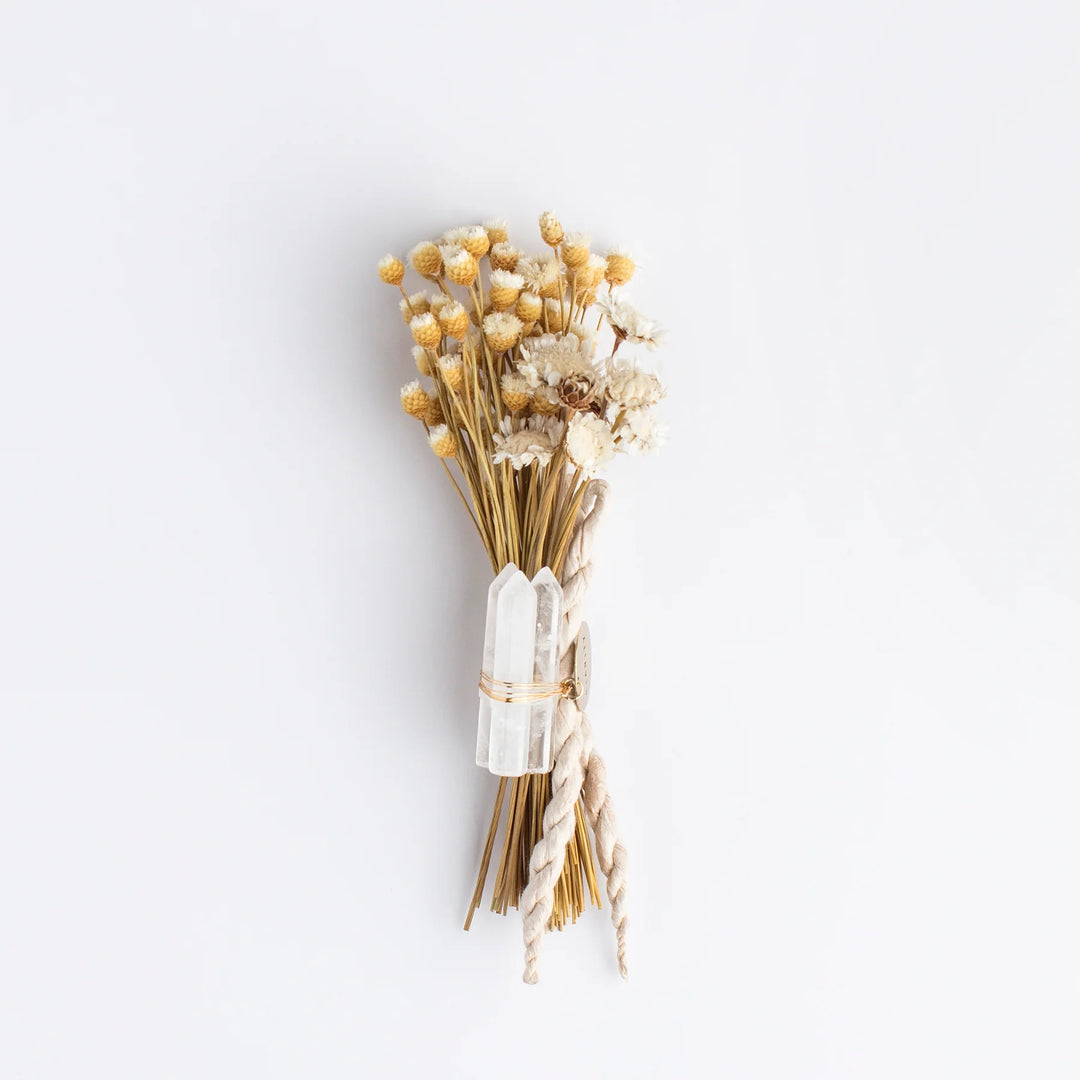 Dried flower bouquet with yellow and white blooms, tied with twine, featuring two clear crystals. Embracing Compassion and Honoring Our Babies: World Pregnancy and Infant Loss Remembrance Day.