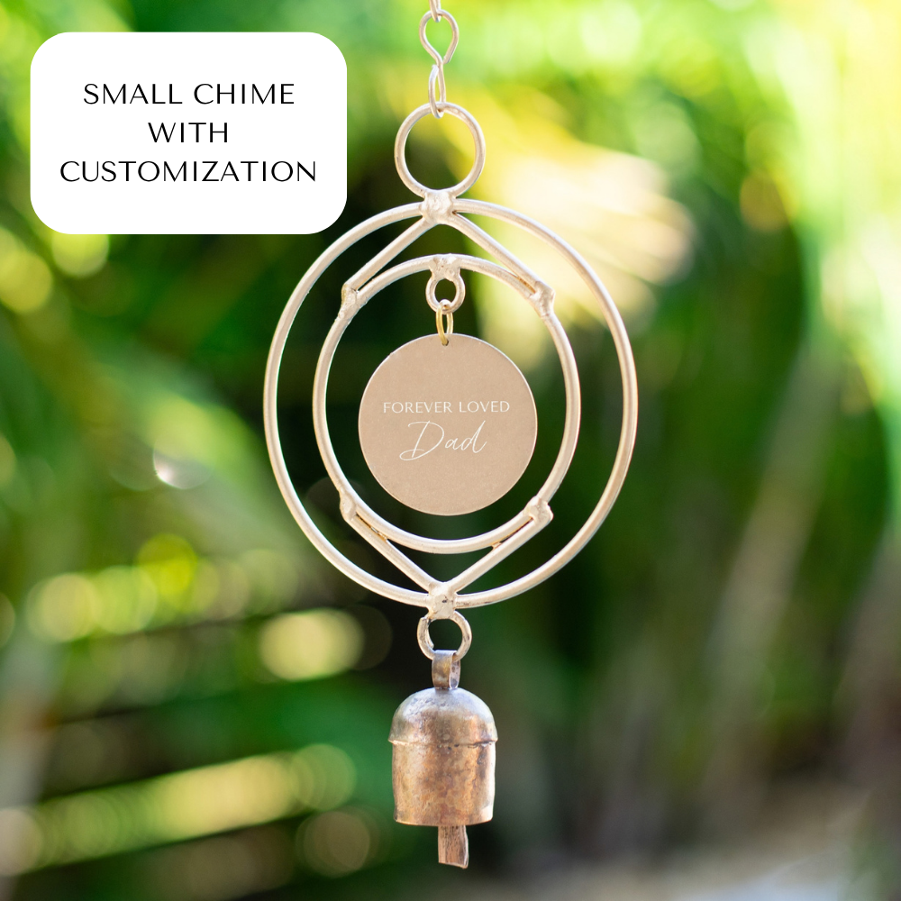 Small chime with a circular frame, metallic color, features a engraved tag reading 'Forever Loved Dad'.