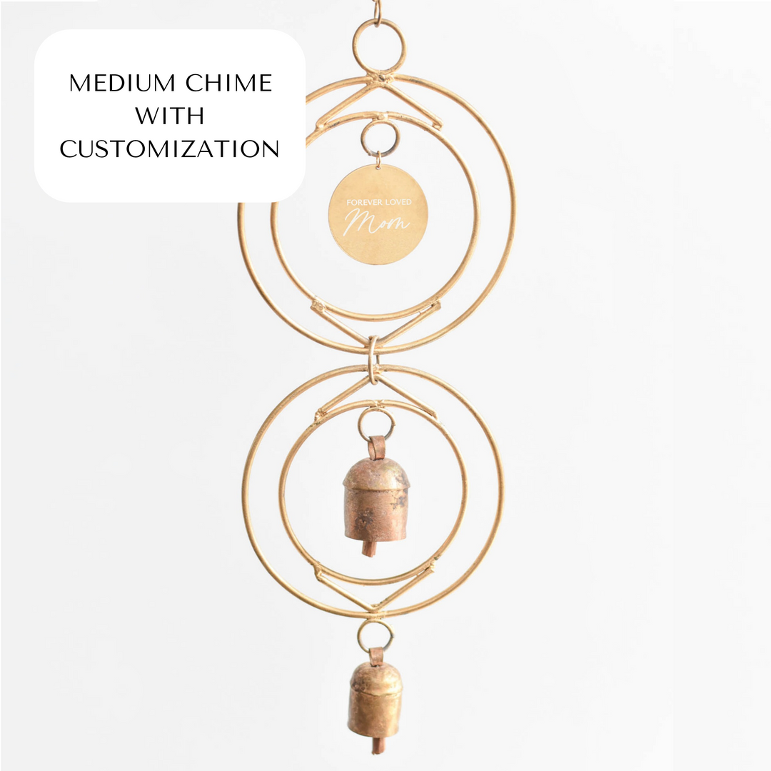 Medium chime with customization, features gold rings and two bronze bells, engraved tag reading &