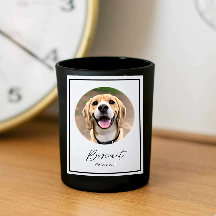 Custom Memorial Pet Photograph Candle with a black exterior and a circular photo of a smiling dog named Biscuit.