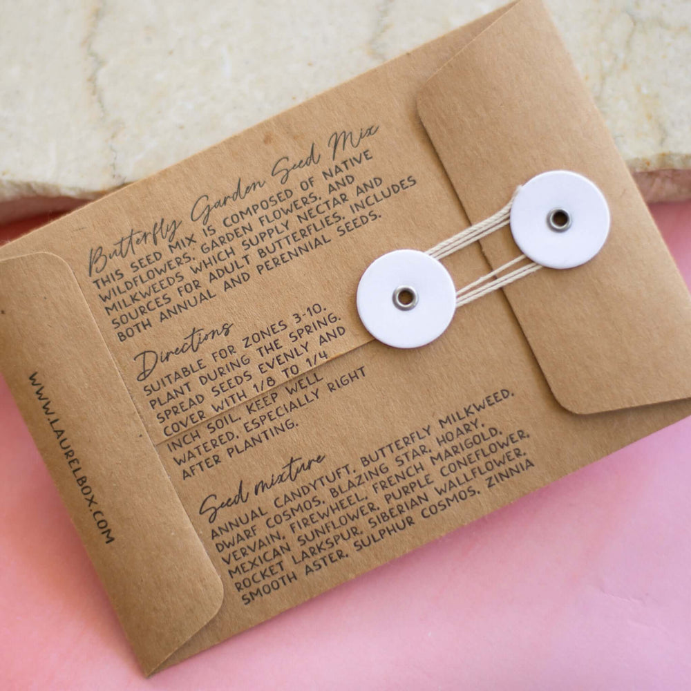 Brown kraft paper seed packet with white buttons, featuring text about seed mix ingredients and planting instructions. In Memory of a Beloved Pet Garden Seed.