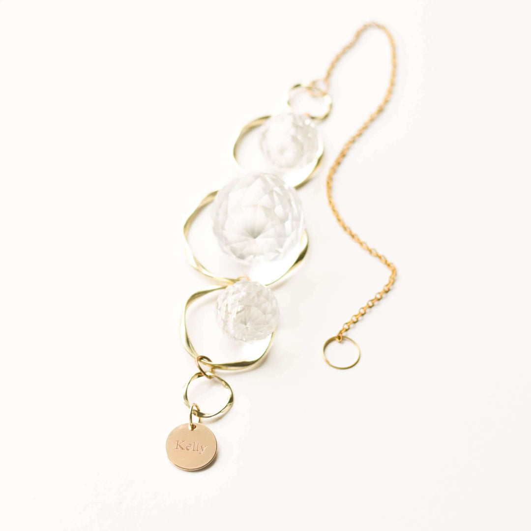 Custom Memorial Sun Catcher and Rainbow Maker with clear glass beads and gold metal chain, engraved charm labeled &
