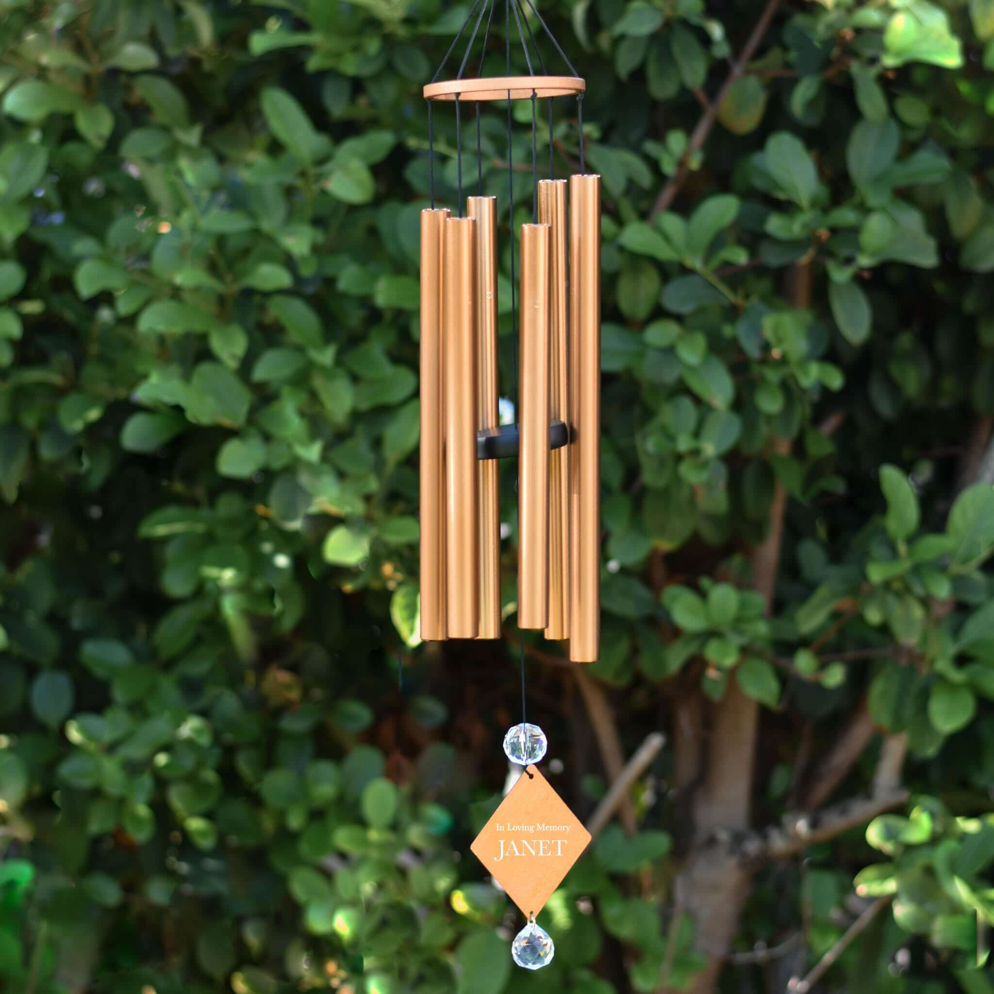 Custom Sympathy Wind Chime and Sun Catcher in copper finish with engraved tag 'In Loving Memory JANET' and crystal accents.