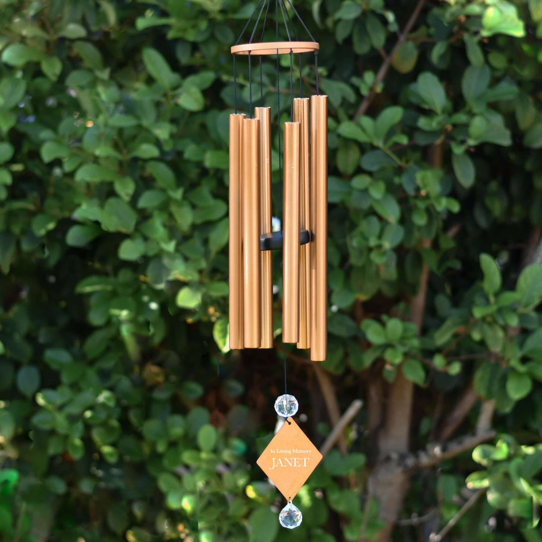 Custom Sympathy Wind Chime and Sun Catcher in copper finish with engraved tag 'In Loving Memory JANET' and crystal accents.