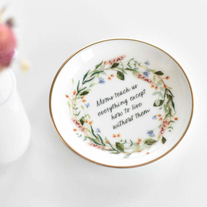 In Memory of Mom Gift Box round porcelain dish with gold trim, floral wreath, and text in center about moms teaching us.