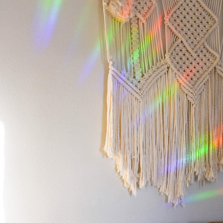 Always by My Side Pet Memorial Rainbow Decal with prismatic rainbow reflections on a light wall, made of clear material.