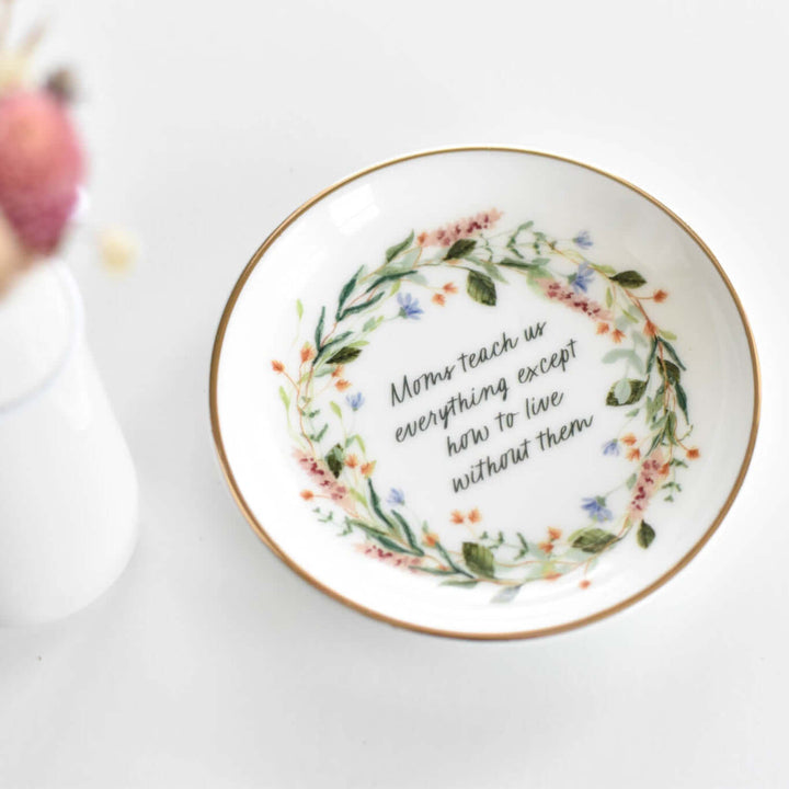 4" porcelain jewelry dish with floral design and quote, "Moms teach us everything except how to live without them." A Mom&