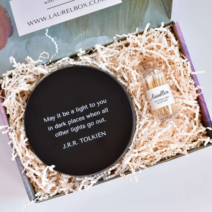 Morningside Employee Sympathy Gift includes black candle holder with J.R.R. Tolkien quote and a jar of matches in shredded paper.