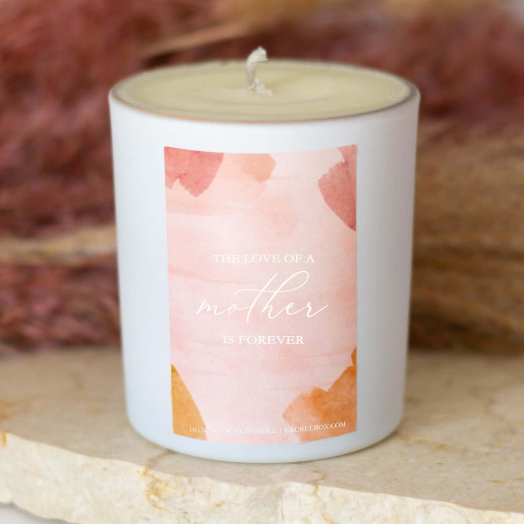 I’ll Always Love You, Mom candle in a white holder with a pink label that reads &