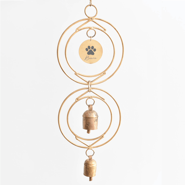Personalized Dog Loss Wind Chime with custom engraved name tag and two handcrafted bronze bells, hanging on a gold frame.