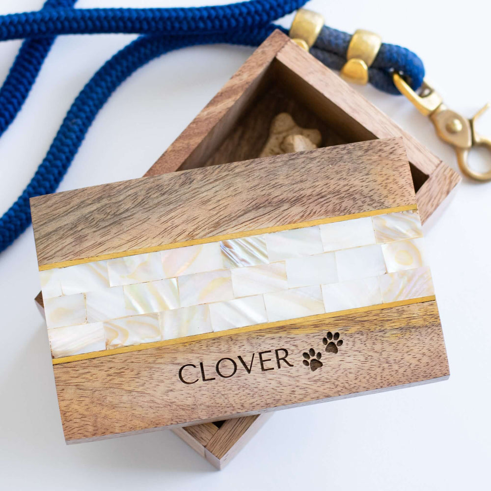Pet Keepsake Memory Box made of mango wood with mother of pearl inlay, engraved with "CLOVER" and paw prints.