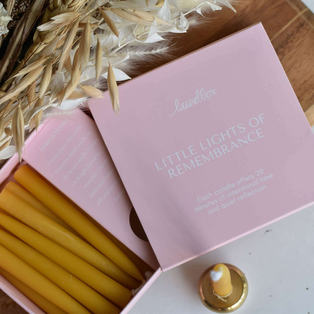 Little Lights of Remembrance pink box with yellow candles, text on box offers 20 minutes of reflection, condolence gift box.
