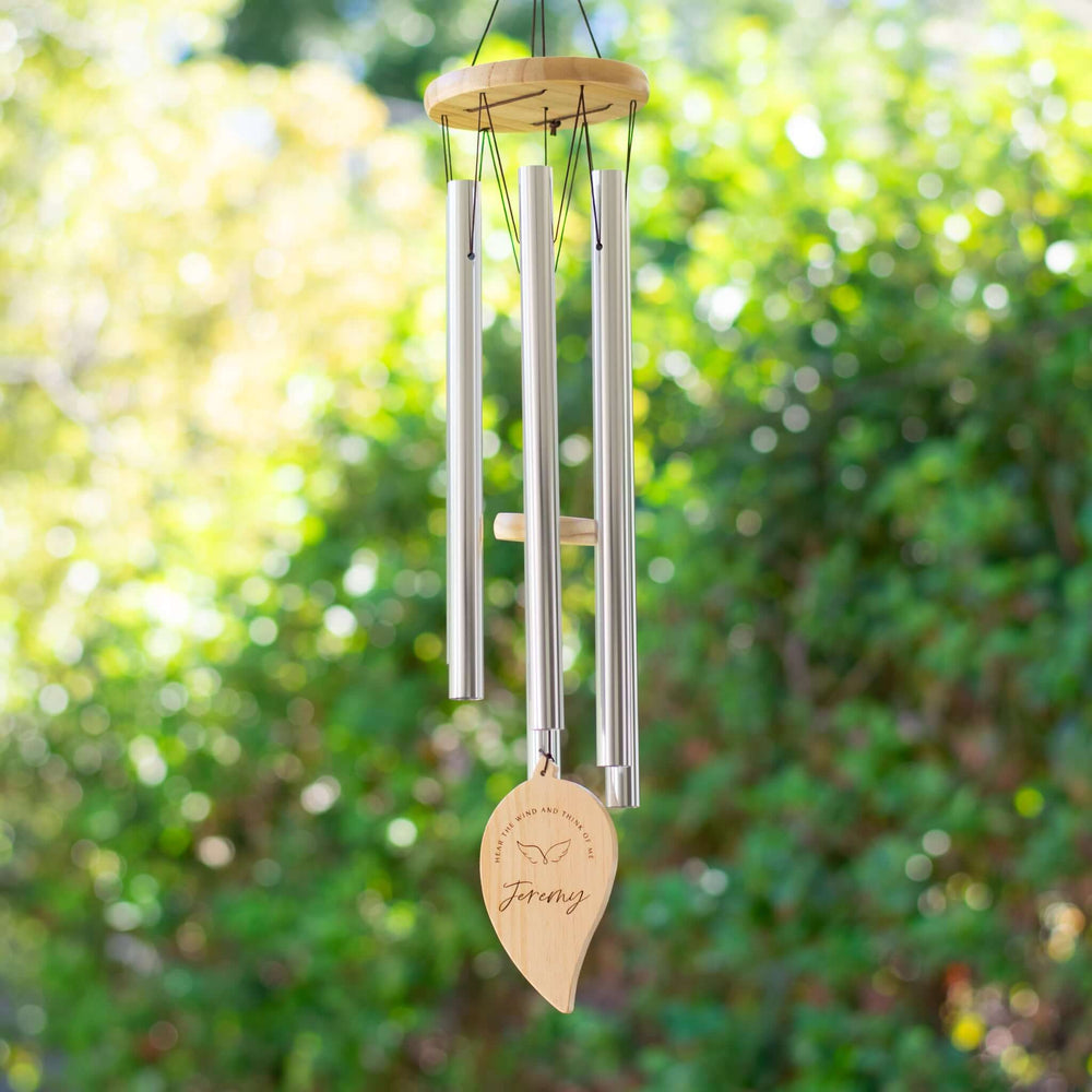 Hear the Wind and Think of Me Wind Chime with five silver tubes, wooden top, engraved name 'Jeremy', and angel wings design.