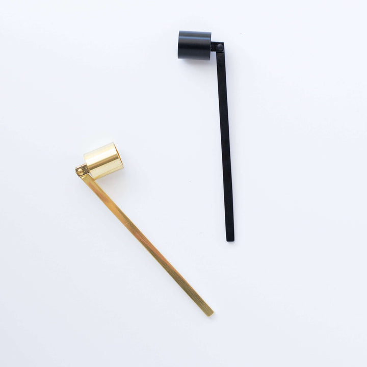 Candle Snuffer set, one brushed gold and one matte black, both with cylindrical extinguishing ends and straight handles.