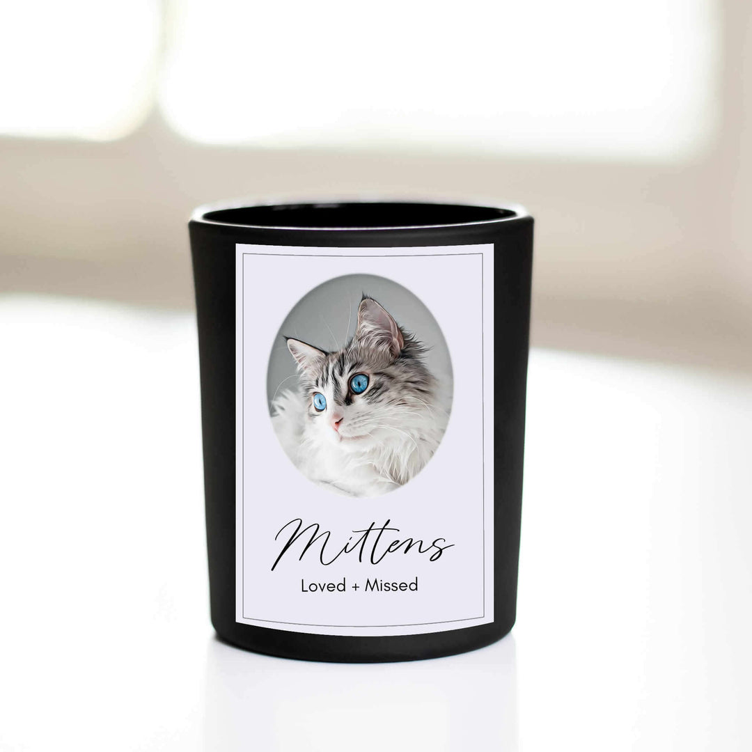 Custom Memorial Pet Photograph Candle featuring a black container with a pet photograph label, name: Mittens, and text: Loved + Missed.