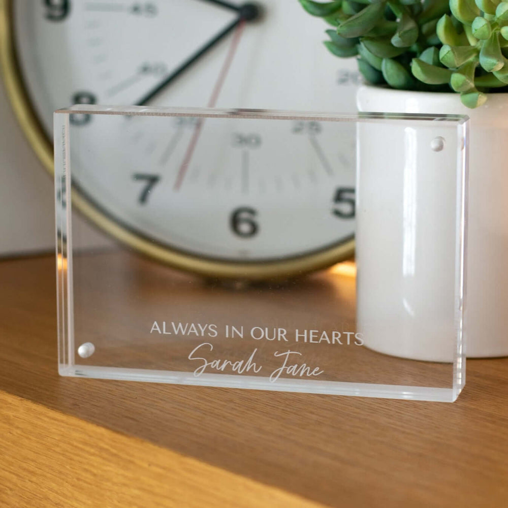 Custom Engraved Memorial Photo Frame in clear acrylic, engraved with "ALWAYS IN OUR HEARTS Sarah Jane" text.