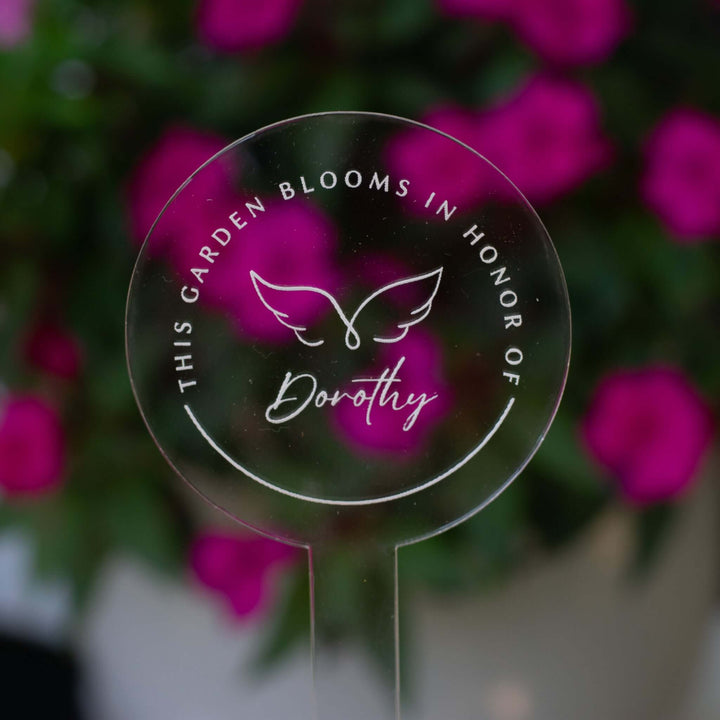 Custom Memorial Garden Stake made of clear acrylic with engraved wings design and the name &