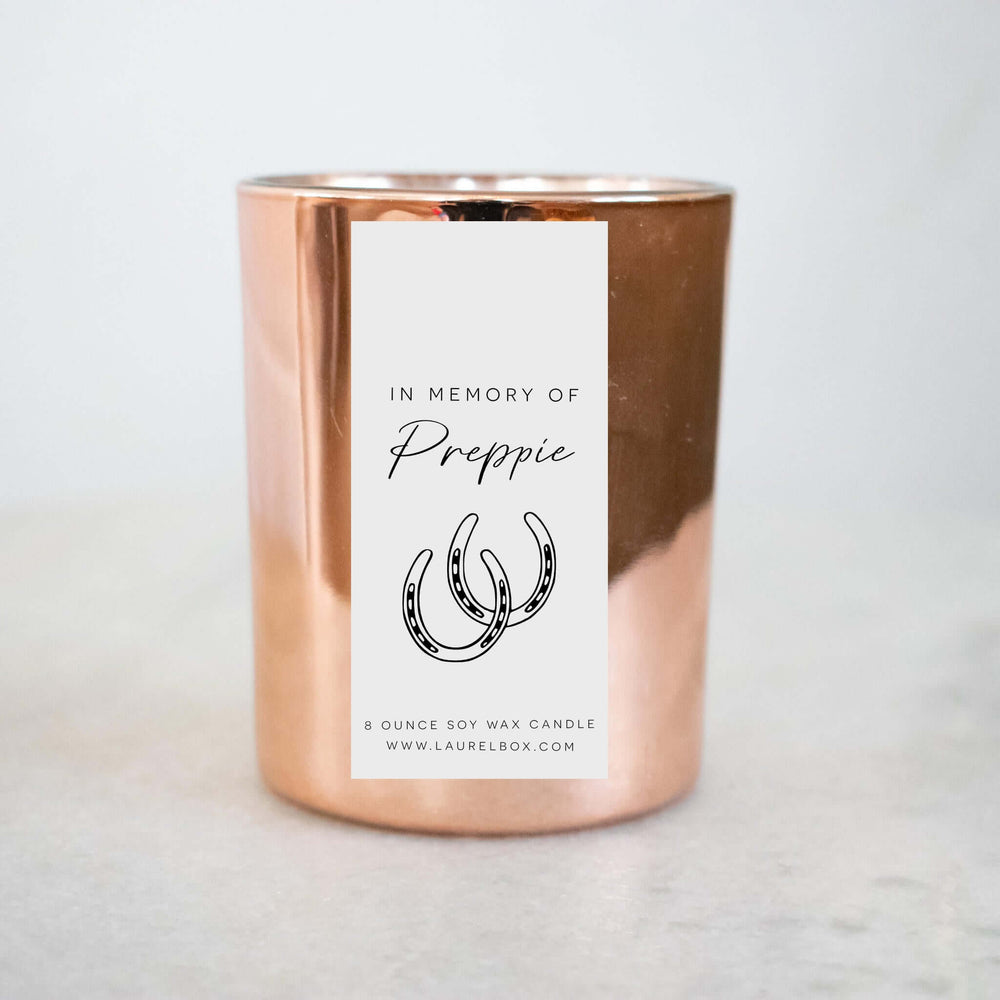 Custom Pet Memorial Candle in copper color with label reading 'In Memory of Preppie' and horseshoe design.