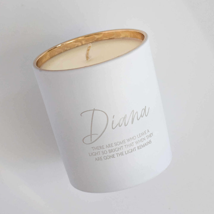 Their Light Remains Candle in white with gold rim, engraved with the name Diana and memorial quote.