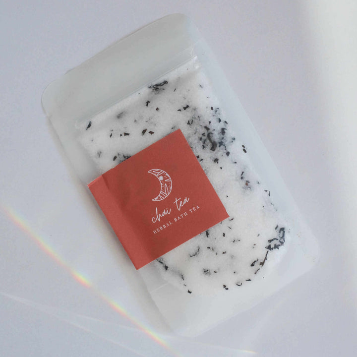 Chai Tea Herbal Bath Tea in a recyclable plastic bag with a red label featuring white text and leaf design.