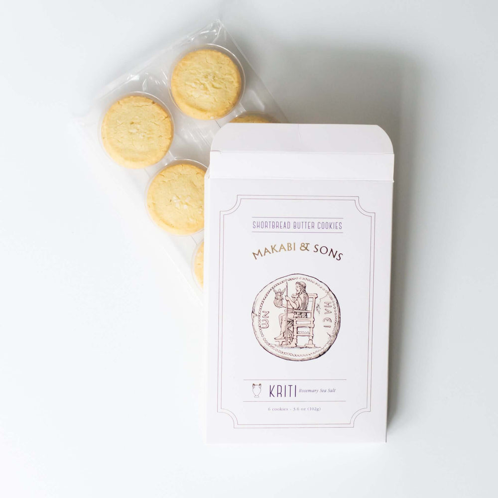Shortbread Rosemary and Sea Salt Cookies in a white box with purple text, showing 6 round cookies in transparent packaging.
