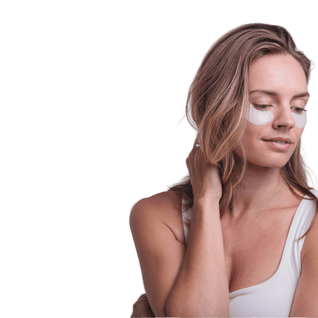 Soothing Under Eye Hydrogel Mask on a woman with light skin, wearing white patches under her eyes, smiling gently.